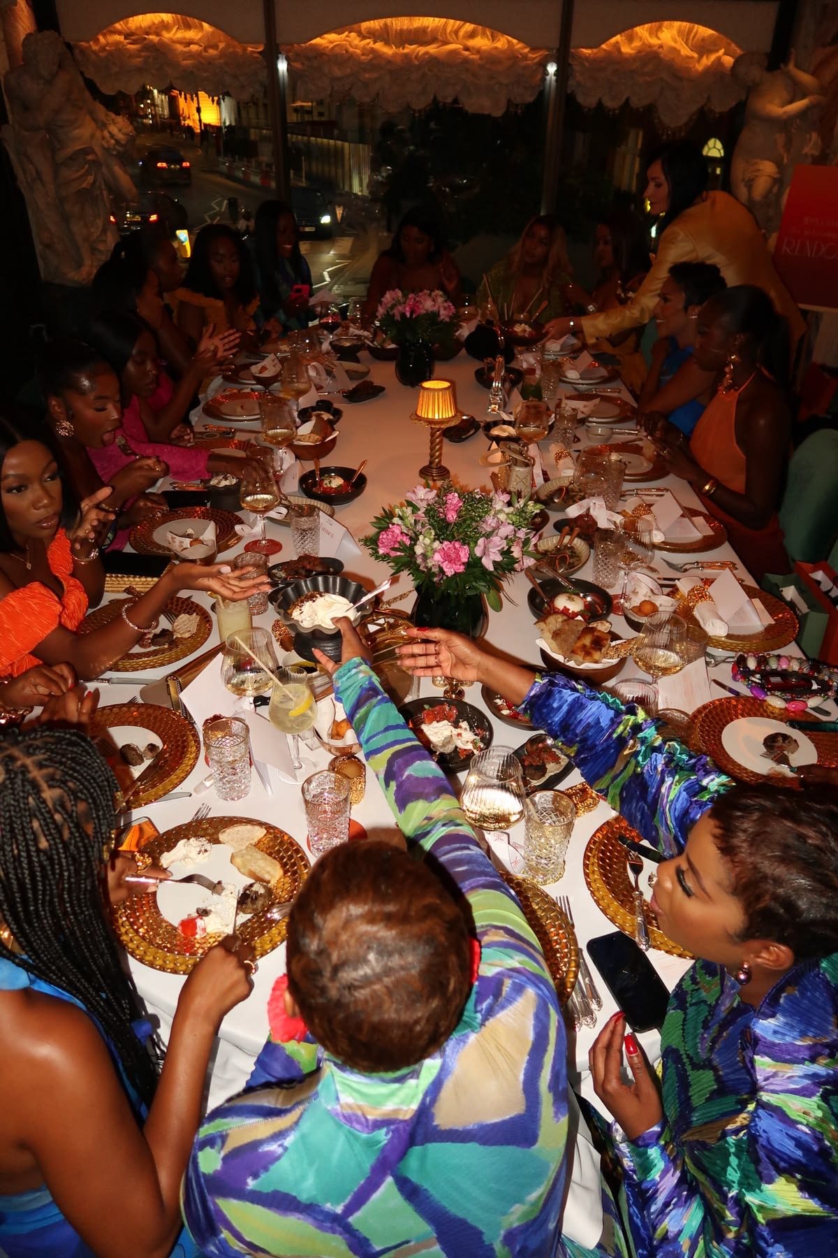 Candlelit long table with guests during dinner