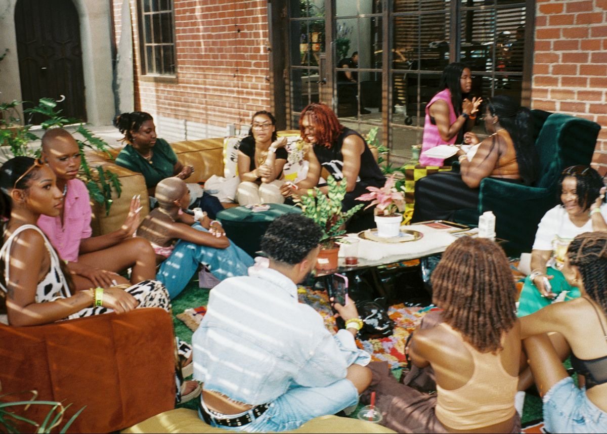 Guests relaxing together before a supper club dinner